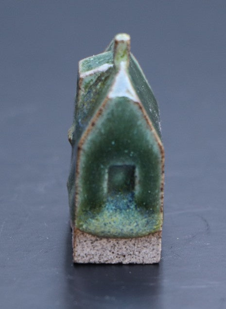 Huis klein mosgroen
